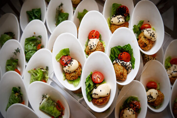 Glass with food appetizer on a table.