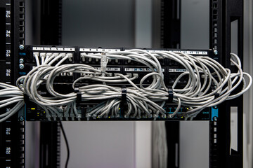 A lot of network cables connected in a big network switch.