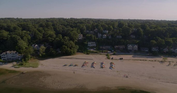 Aerial Pan Around from Beach Shore to Boats Docked at Huntington Bay Long Island