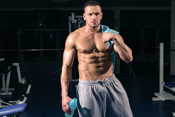 Fototapeta na wymiar Sport health. Stay hydrated concept. Weightlifter gym man preparing for training. Muscular athletic body.