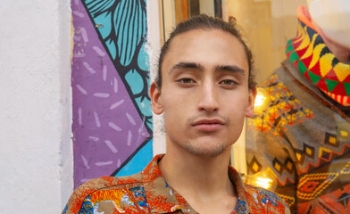 portrait of a young hispanic model in la candelaria bogota colombia, hippie with collected hair
