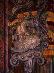 Vietnam, Hanoi. Old Quarter, Ngoc Son Temple (also known as Turtle Temple). Carving of a turtle holding a paintbrush.