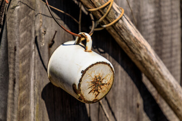 Ukraine, Pripyat, Chernobyl. Tin cup hanging from house door.