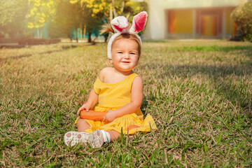 Portrait of a baby in bunny ears.