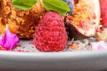 Strawberry cornflakes crusted French toasts with fresh summer fruit, coconut flakes topped with mascarpone, vanilla ice cream and silky smooth fairy floss