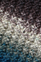 Colorful handmade winter scarf with alpacas wool macro background modern high quality prints