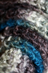 Colorful handmade winter scarf with alpacas wool macro background modern high quality prints