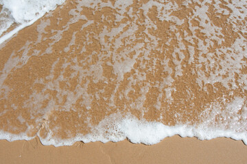Fototapeta na wymiar white wash on beach shore