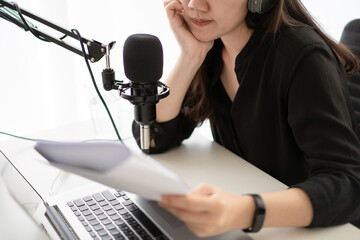 Asian woman live a podcast streaming at home.