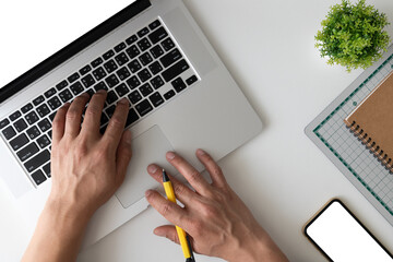 businessman working on laptop at table in office