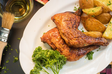 Baked chicken with potatoes and salad 