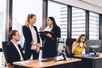 Group of professional business meeting and discussing strategy with new startup project.Creative business people planning and brainstorm with desktop computer in modern office.Teamwork concept