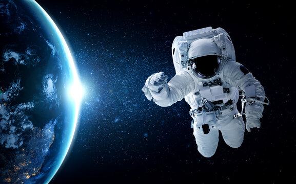 Astronaut spaceman do spacewalk while working for space station in outer space . Astronaut wear full spacesuit for space operation . Elements of this image furnished by NASA space astronaut photos.