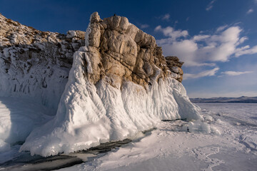 Ice-covered rock on Oltrek Island. Winter Baikal
