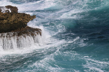 waves crashing on rocks