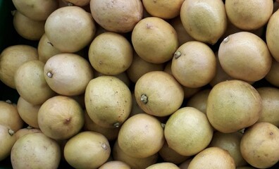 fresh lemons are sold in the market