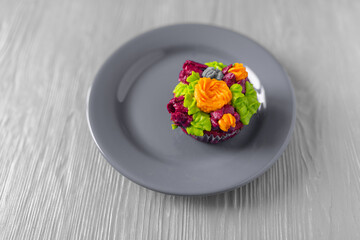 Delicious organic cupcake prepared at home, on a plate close-up.