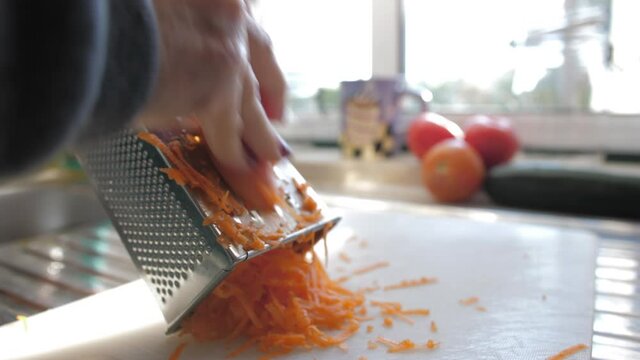 grate carrot on grater 4k