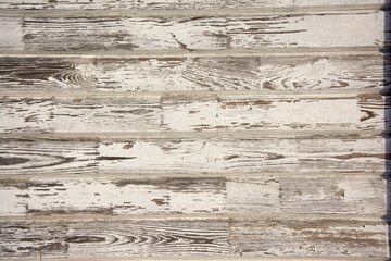 natural old boardwalk wooden background with peeled white paint, patina, vintage