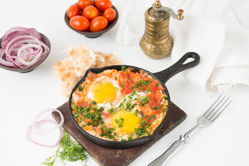 Shakshuka-a traditional Arabic dish made of eggs, peppers and tomatoes