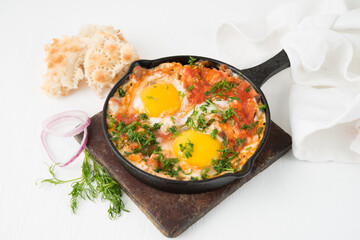 Shakshuka-a traditional Arabic dish made of eggs, peppers and tomatoes