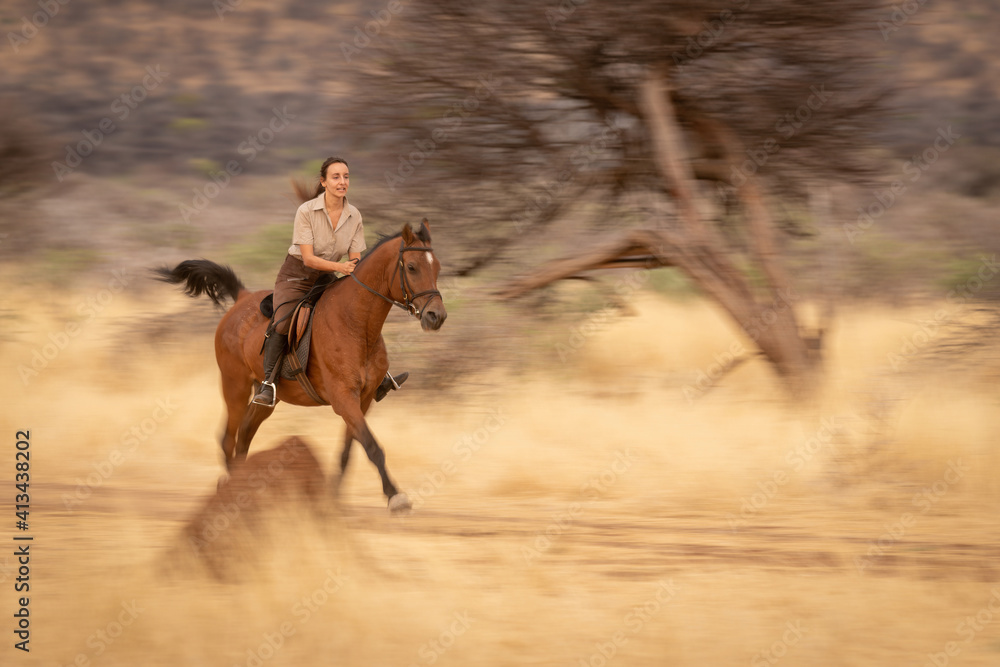 Poster slow pan of brunette riding along track