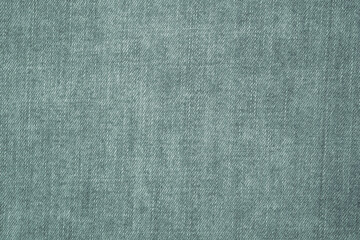 Denim grey jeans fabric. Denim background texture for design. Canvas denim. Blue jeans texture for any background.