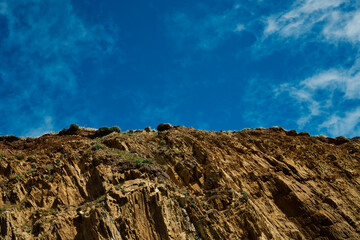 Rocks against a bright blue sky