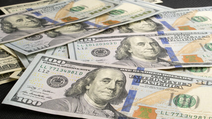 One hundred American dollar bills. dollars banknotes. 100 American dollars. Franklin. paper money, currency, cash. finance, payments. close-up