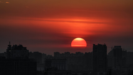 Sunset over a large city.