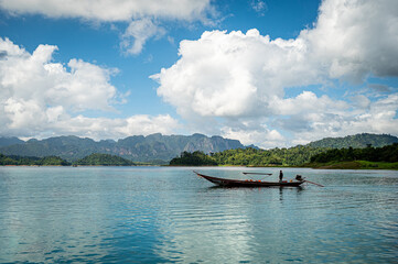 Landscape of lake with cleared blue sky clouds and a boat