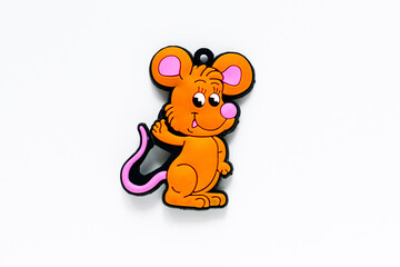 Orange mouse toy standing on a white background isolated. Bright colored figurine, template for collage. Cute and funny kids board colored toy. Childs game little single figurine with copyspace