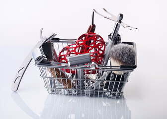 Razors, brush, stand heart in a handbasket on a white background.