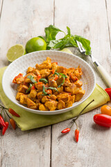 chicken stewed with tomatoes and red hot chili pepper