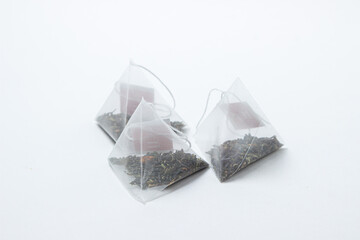Pyramid tea bags on a white background. Fast brewing tea.