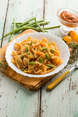 pasta with dried tomatoes pesto and green peas