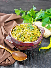 Kitchari in bowl on dark wooden board