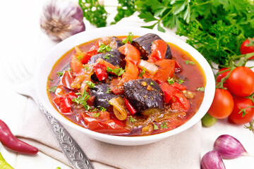 Ragout vegetable with eggplant on light board