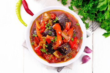 Ragout vegetable with eggplant on white board top
