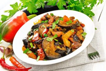 Ragout with eggplant and pepper on board