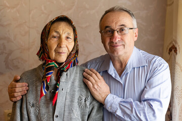 Man hugging his Mother wearing Hijab
