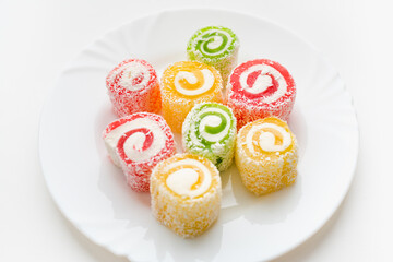 Turkish delight on a white background, oriental sweets, a plate of sweets 