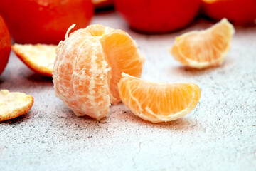 Ripe tangerines on a stone countertop