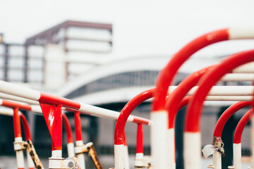 detail of road barriers in front of architecture