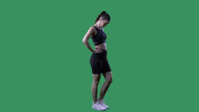 Side view of fit woman neck stretching head nodding exercises. Full body on chroma key green screen.