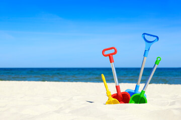 Baby toys on a sandy beach