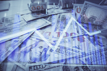 Multi exposure of forex chart drawing over us dollars bill background. Concept of financial success markets.