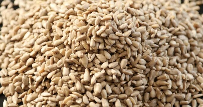 Top view pile of peeled sunflower seeds rotating