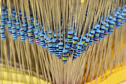 Resistors arranged in the form of a hollow triangle, one of the corners of which is directed directly at the viewer.