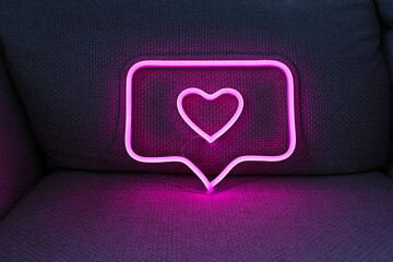 Neon sign pink like Instagram heart in the decor. Trendy style. Valentine day. Neon sign. Custom...